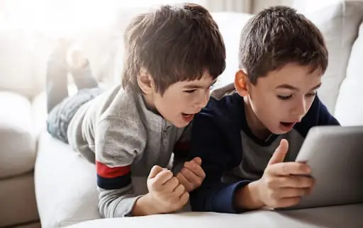 kids watching tablet - Dr. Roseann