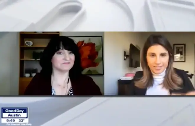 Two women are conversing on a TV screen for a media kit.