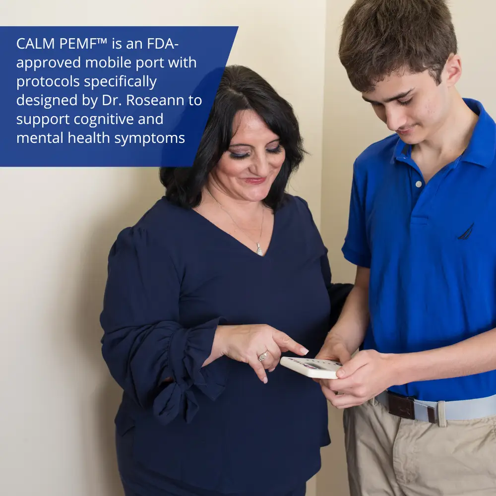 A couple observing a Calm PEMF™ device designed for enhancing attention and learning.