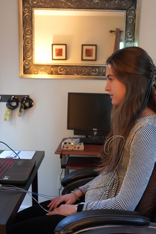 Lia undergoing home-based Neurofeedback session